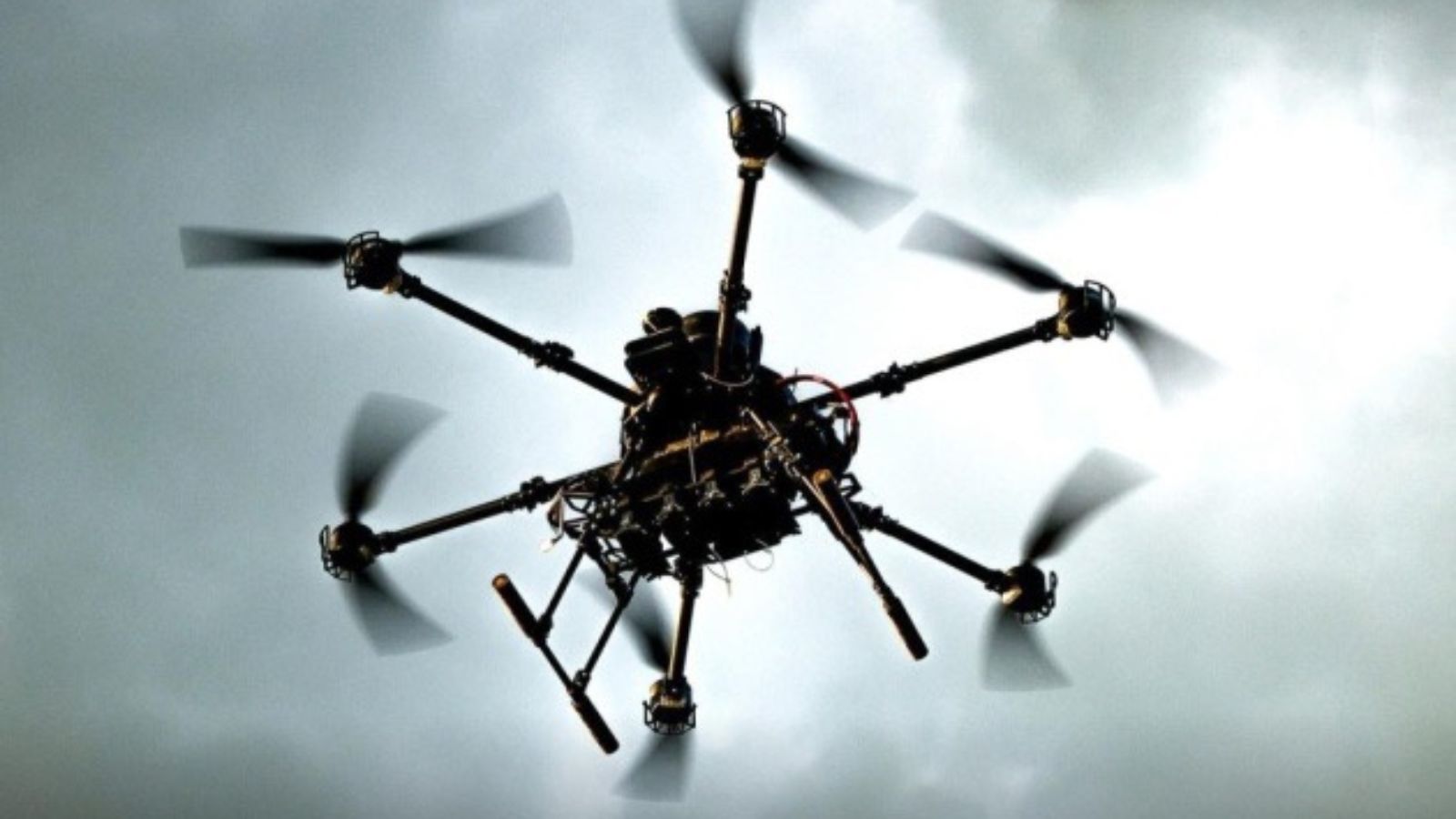 A combat hexacopter (drone with six rotors) of the AFU Unmanned Systems Forces in flight against the sky.